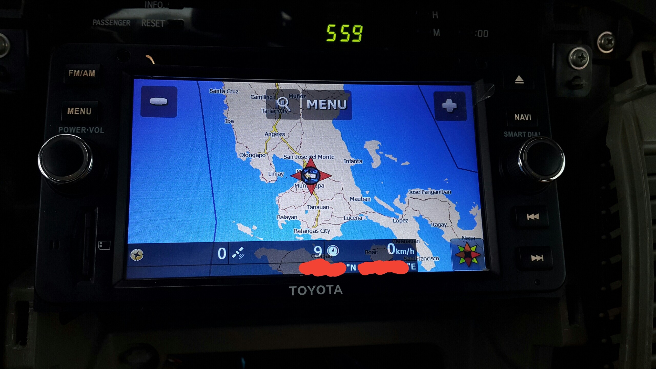 A close-up of a car's navigation screen displaying a detailed map and route