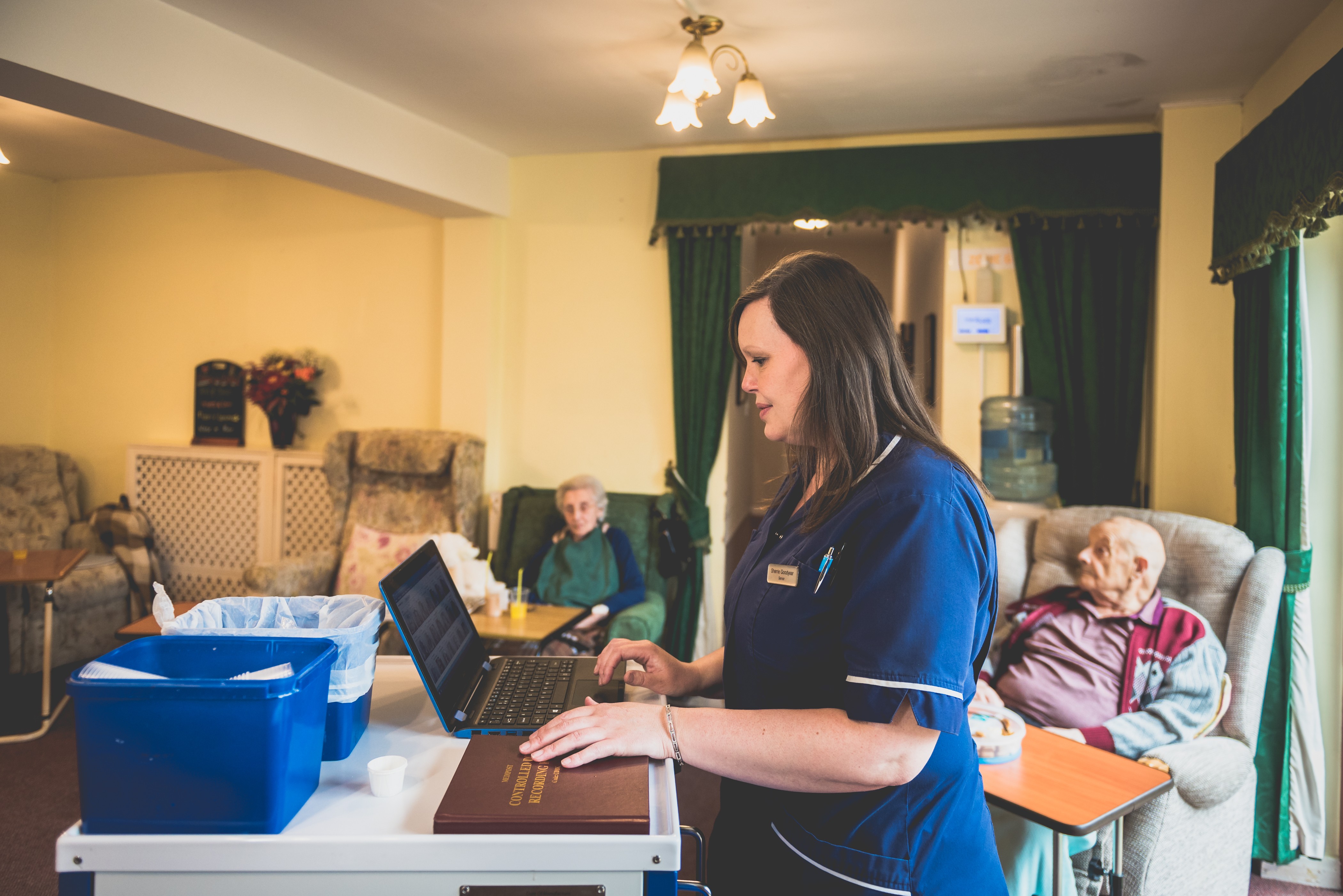 Care home staff discussing audit results