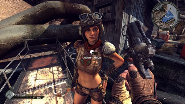 Nicholas Raine standing next to a car in the game Rage, emphasizing car modification and open-world features