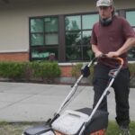 Technician using lawn care software on a tablet