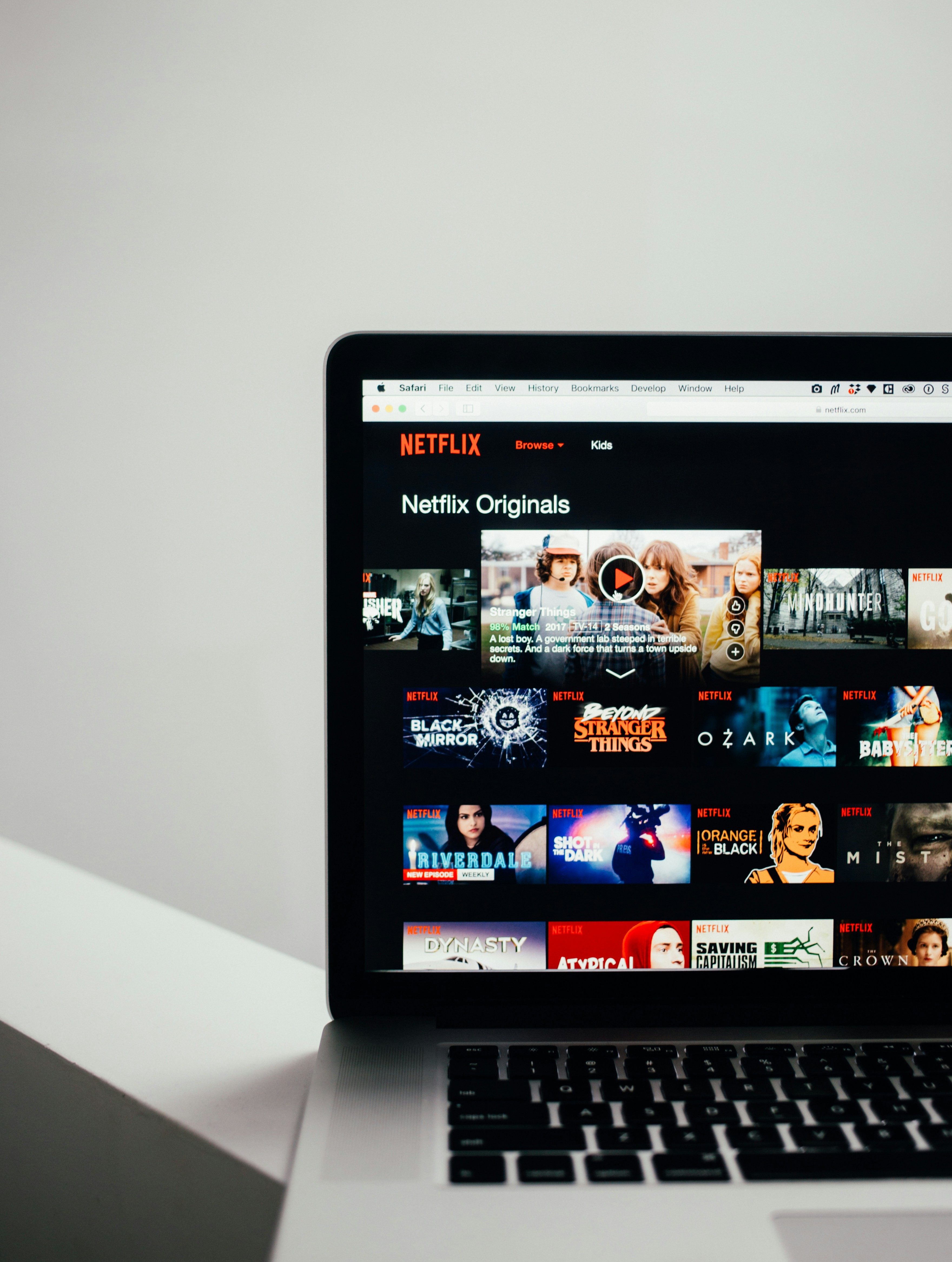 Screenshot of Netflix app on a laptop with download options
