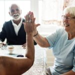 Caregiver assisting elderly resident