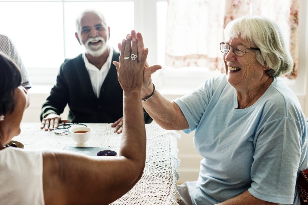 Caregiver assisting elderly resident