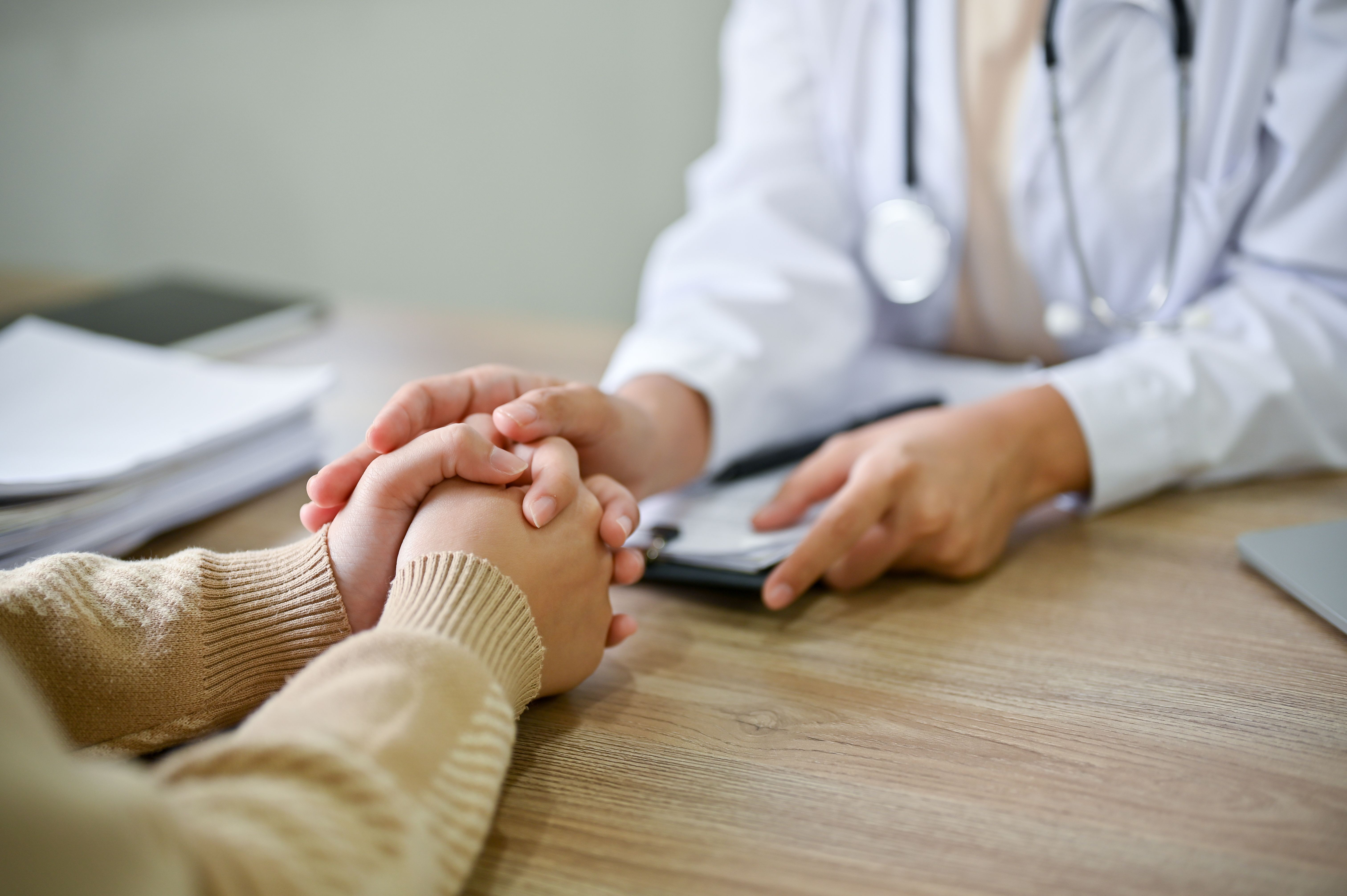 Pharmacist reviewing medication list with a patient