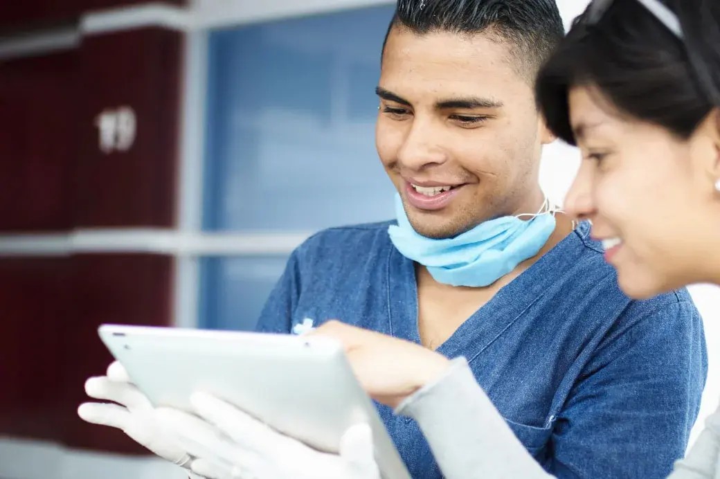 Healthcare staff collaborating using employee experience software