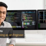 Software developer working on a computer, showcasing the transition from finance to tech