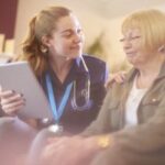 Caregiver Using Home Care Software