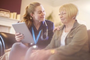 Caregiver Using Home Care Software