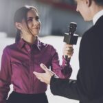 student interviewing man