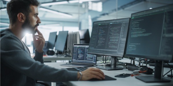 Various software quality assurance engineers working on different devices.